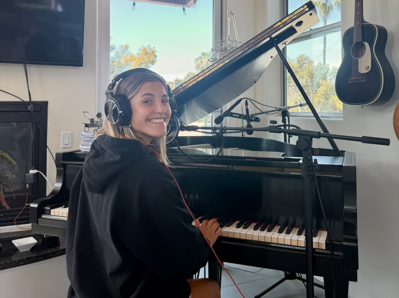 Student Lucy at the grand piano during a lesson in the Encinitas studio