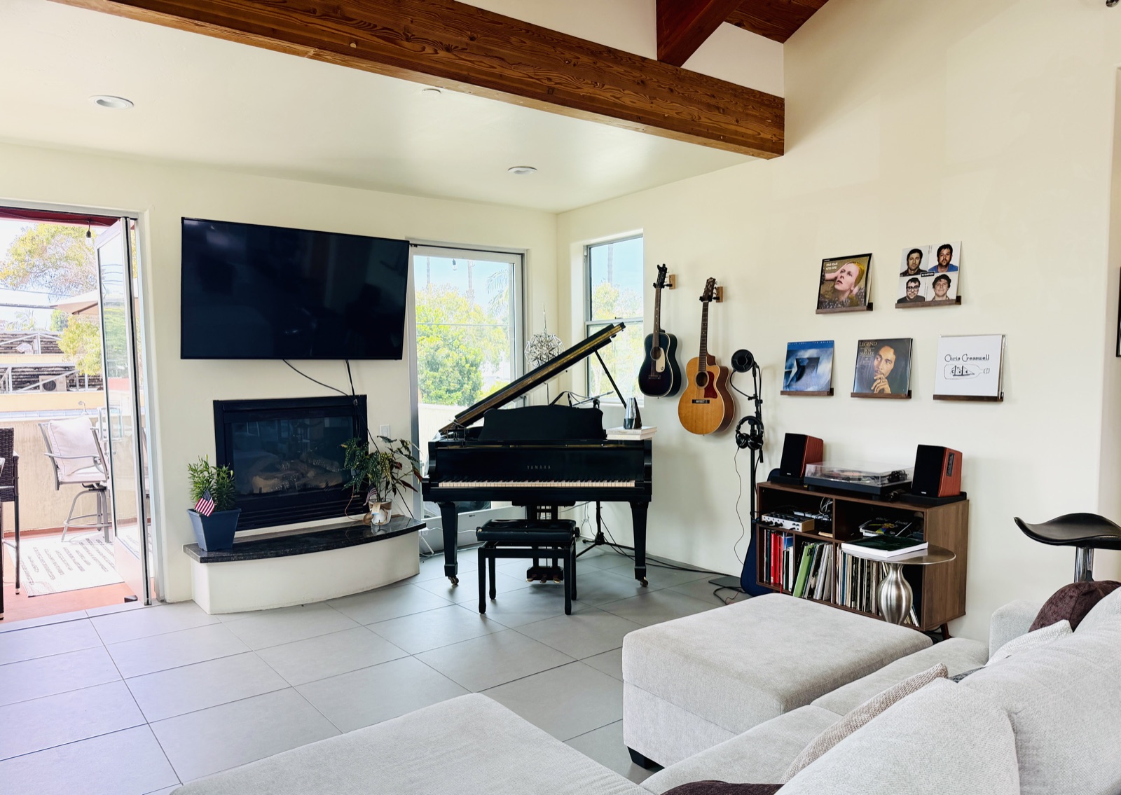 Brian Wahlstrom's teaching studio in downtown Encinitas with a baby grand piano, fireplace, and natural light